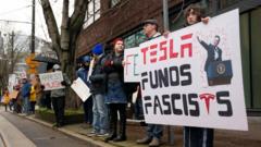 #teslatakeover-protests-take-aim-at-elon-musk